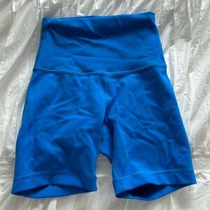 Wonder train 5/4 inch biker shorts, poolside blue, small stain on the front.